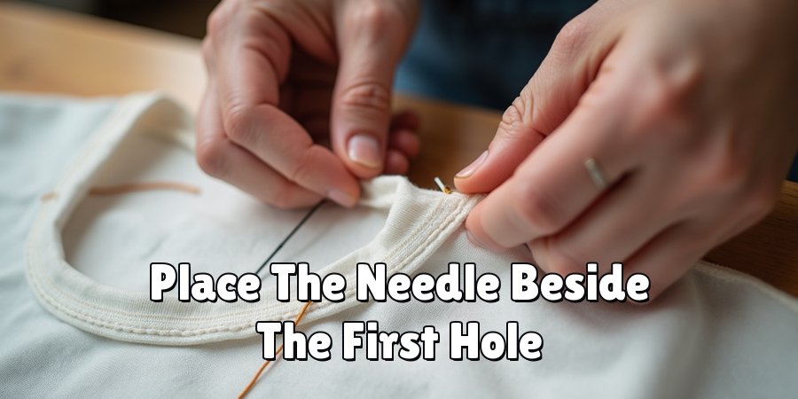 Place The Needle Beside The First Hole