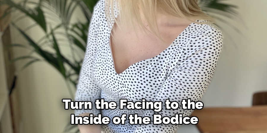 Turn the Facing to the 
Inside of the Bodice